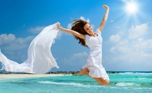 Girl With White Scarf Jumping on The Beach